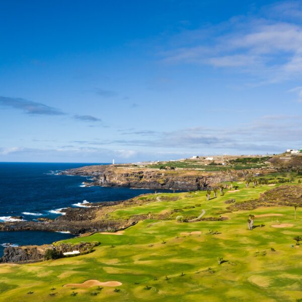 Golf course near the Atlantic ocean in Tenerife, Spain, green Golf course, tennis court in the