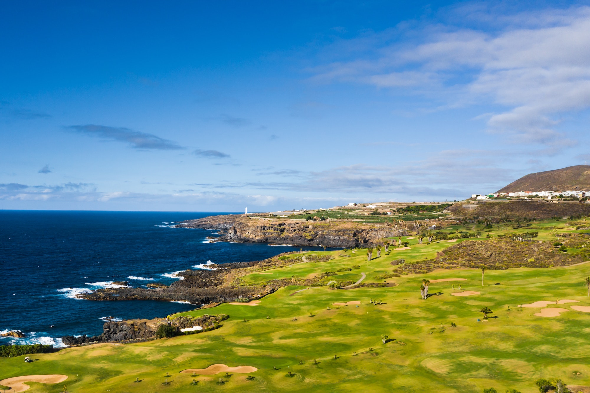 Golf course near the Atlantic ocean in Tenerife, Spain, green Golf course, tennis court in the